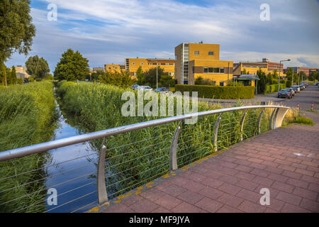 Modern Footbridge in suburban residential area in the Netherlands Stock Photo