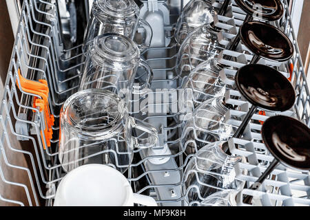 Clean dishes and accessories in dishwasher after washing Stock