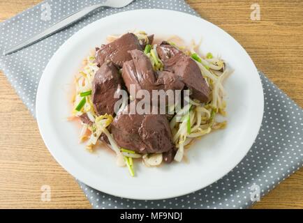 Chinese Traditional Food, A Plate of Stir Fried Bean Sprout with Congealed Pork Blood, Pork Blood Pudding or Pig Blood Curd. Stock Photo