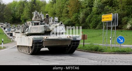 U.S. Soldiers from the 2nd Armored Brigade Combat Team, 1st Infantry Division, drive M1A2 Abrams tanks and other vehicles from the Grafenwoehr Training Area to Hohenfels, Germany, April 23, 2018, April 23, 2018. For the first time in 15 years, the U.S. Army conducted a brigade-level armored tactical road march on German roads as part of exercise Combined Resolve X. (U.S. Army photo by Staff Sgt. Kathleen V. Polanco). () Stock Photo