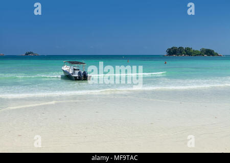 White coral sand on tropical beach. Praslin island, Seychelles Stock Photo