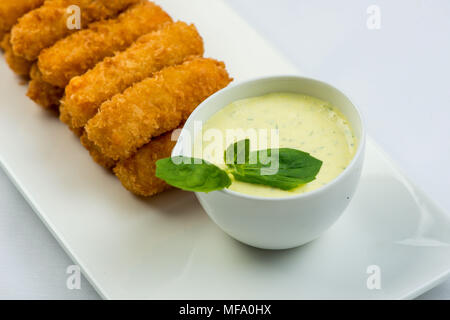 Meat fried in batter with dill in squared plate over white background Stock Photo