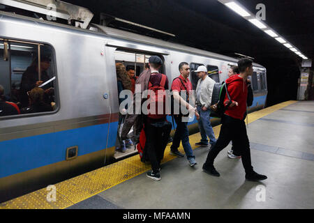 People passengers leaving boarding a subway train on the Blue Line, Maverick Station, Boston Massachusetts USA Stock Photo