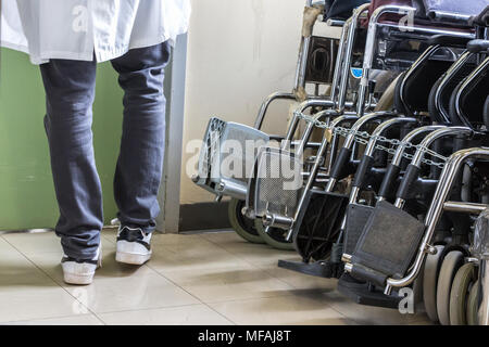 Ioannina, Greece - April 18th, 2018: Group of hospital wheelchairs in a corridor at the University Hospital of Ioannina in the North-West of Greece. Stock Photo