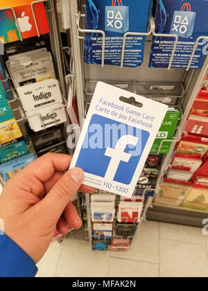 MONTREAL, CANADA - MARCH 31, 2018 : A hand holding a Nintendo prepaid card.  Nintendo eShop is a digital distribution service powered by Nintendo Netwo  Stock Photo - Alamy