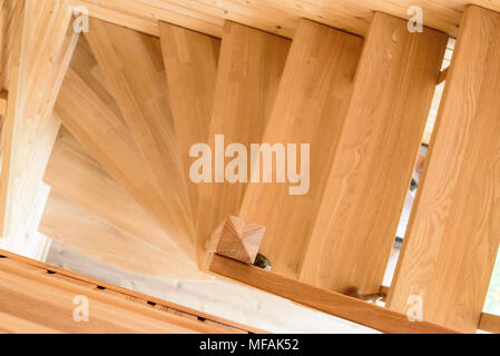 Natural wooden staircase and walls in new house Stock Photo