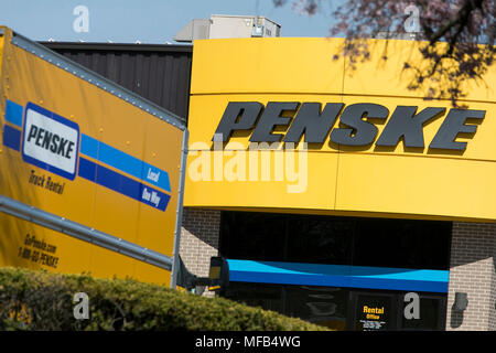A logo sign and rental trucks outside of a facility occupied by Penske Truck Leasing in Reading, Pennsylvania, on April 22, 2018. Stock Photo