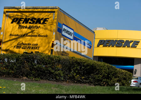 A logo sign and rental trucks outside of a facility occupied by Penske Truck Leasing in Reading, Pennsylvania, on April 22, 2018. Stock Photo