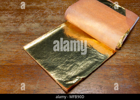 A book of gold leaf for use with a gold leaf electroscope.  As used in a UK secondary/high school. Stock Photo