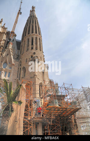 Cranes and scaffolding surround the building of the Sagrada Família Church in its ongoing construction in Barcelona, Spain. Stock Photo
