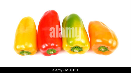 Colored peppers over white background. Stock Photo