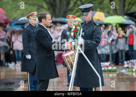 French President Emmanuel Macron participates in a wreath-laying ceremony at the Tomb of the Unknown Soldier at Arlington National Cemetery, Arlington, Virginia, April 24, 2018.  President Macron’s visit to Arlington National Cemetery was part of the first official State Visit from France since President Francois Hollande came to Washington in 2014.  President Macron along with his wife, Brigitte Macron, also visited the gravesite of former President John F. Kennedy. (U.S. Army photo by Elizabeth Fraser / Arlington National Cemetery / released) Stock Photo