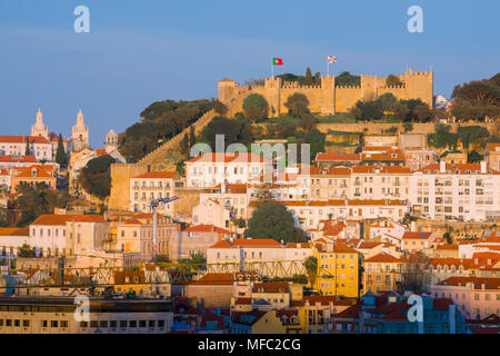 Lisbon skyline, view of the Castelo de Sao Jorge at sunset with the crowded hillside buildings of the Mouraria quarter sited below, Lisbon, Portugal. Stock Photo