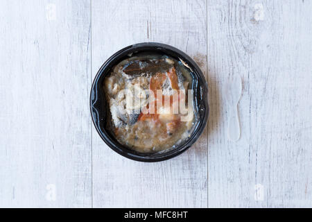 Instand Seafood Gilt-Head Sea Bream Fish in Plastic Container with Fork / Steamed Fish Stew. Organic Food. Stock Photo