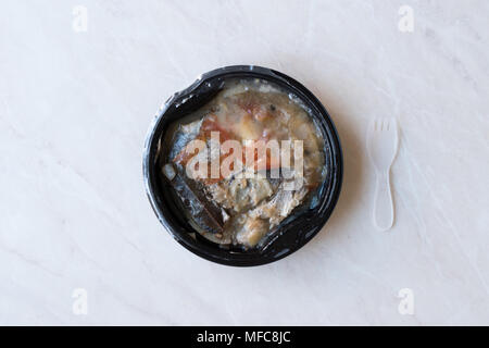Instand Seafood Gilt-Head Sea Bream Fish in Plastic Container with Fork / Steamed Fish Stew. Organic Food. Stock Photo
