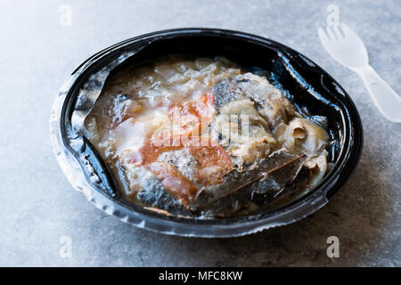 Instand Seafood Gilt-Head Sea Bream Fish in Plastic Container with Fork / Steamed Fish Stew. Organic Food. Stock Photo