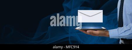 Envelope letter message and man using tablet Stock Photo