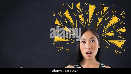 Shocked woman with tense doodles triangles on blackboard Stock Photo