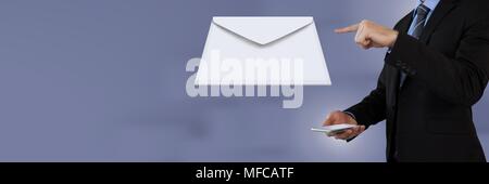 Envelope letter message and man using tablet Stock Photo