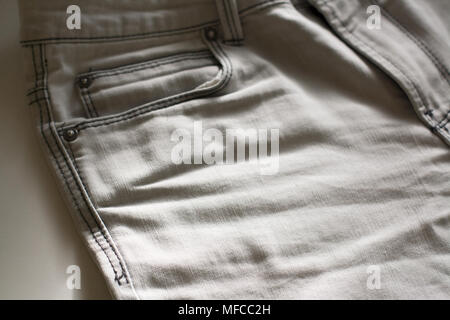 Light grey jeans texture close up Stock Photo