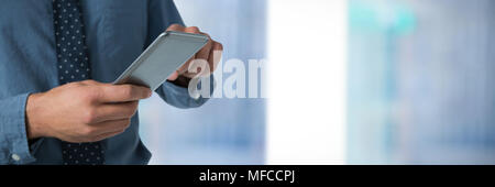 Composite image of mid-section of business man using smartphone Stock Photo