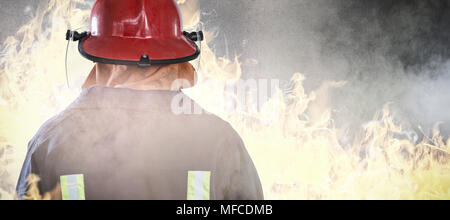 Composite image of back of firefighter Stock Photo