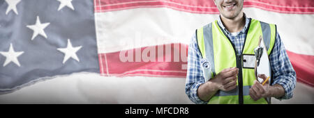 Composite image of happy construction worker Stock Photo