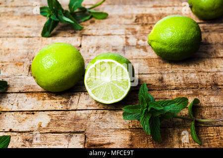 Lime slices on rustic wooden background. Healthy food Stock Photo