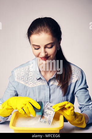 conceptual image on which the woman launder shady money Stock Photo