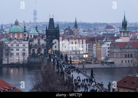 High angle view of the famous Charles Bridge and the old town tower and churches in Prague, Czech Republic capital city at nightfall