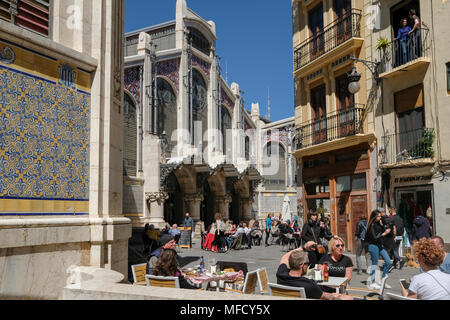 People sitting outside cafes near popular Mercado Central food market, North Ciutat Vella, Valencia, Spain. Stock Photo