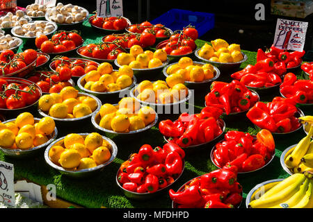 Bridport, Dorset, UK.  25th April 2018. A colourful display of fruit and vegetables on a market stall at Bridport in Dorset during the towns Wednesday market day.  Picture Credit: Graham Hunt/Alamy Live News Stock Photo