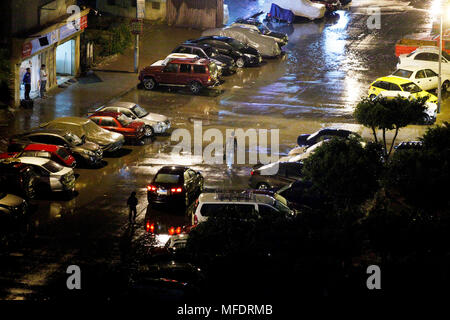 Cairo, Egypt. 25th Apr, 2018. Pedestrians walk in the rain in Cairo, Egypt, on April 25, 2018. Several parts of Cairo and Giza witnessed heavy rainfall with lightning and thunder on Wednesday. Credit: Ahmed Gomaa/Xinhua/Alamy Live News Stock Photo