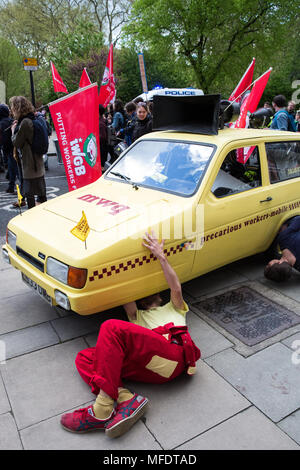 London, UK. 25th April, 2018. Members of the Independent Workers Union of Great Britain (IWGB) and their supporters attend a protest march in solidarity with workers employed by outsourcing companies contracted to the University of London currently striking to demand equal terms and conditions with those directly employed by the university. Cleaners, porters, security officers, receptionists, gardeners, post room staff and audiovisual staff have joined the strike after a near unanimous vote for industrial action. Credit: Mark Kerrison/Alamy Live News