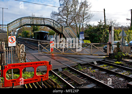 Manually operated crossing gates at Brundall Railway Station, on the ...