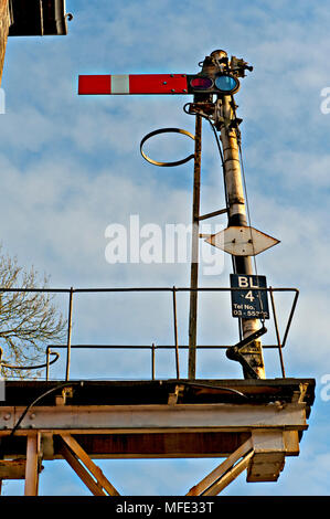 A semaphore starter stop signal in elevated position at Brundall Railway Station on the Wherry Lines in Norfolk, UK Stock Photo