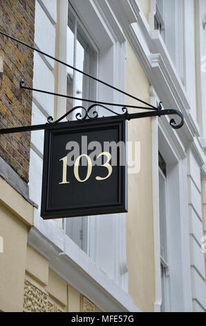 Number 103 one hundred and three on a sign outside a property Stock Photo