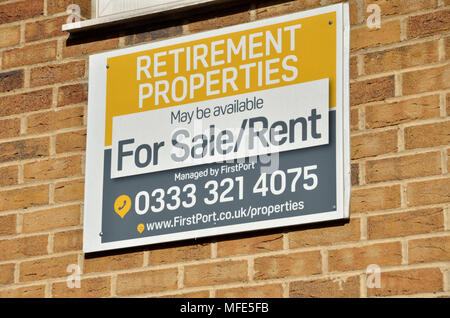 Estate agent board advertising retirement properties for sale or rent. Stock Photo