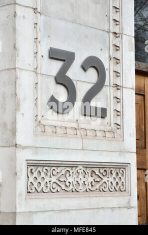 Street 32 thirty-two on a wall. Stock Photo