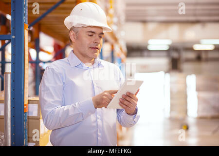 Smart nice businessman using a tablet Stock Photo