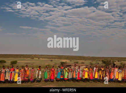 Masai women dancing and singing a welcome song, Kenya. Stock Photo