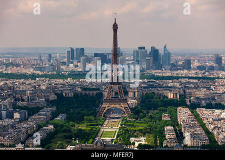 Aerial view of Eiffel Tower, Champ de Mars and La Defense district on background as seen from Montparnasse Tower in Paris, France. Stock Photo