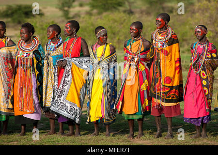 Masai women dancing and singing a welcome song, Kenya Stock Photo