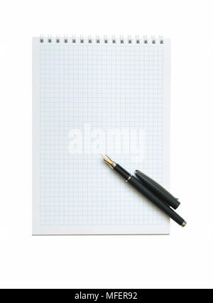 Fontain pen lying on open spiral notebook. Isolated on white with clipping path Stock Photo