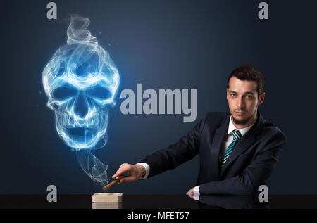 Businessman smoking with skull simbol above his head. Stock Photo