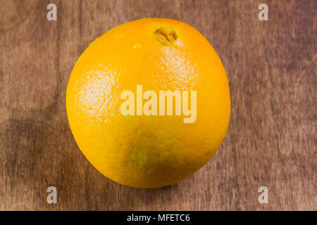 fresh, jucy, orange on a wooden background Stock Photo