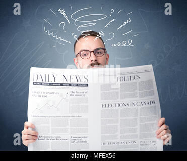 Confused businessman holding newspaper concept Stock Photo