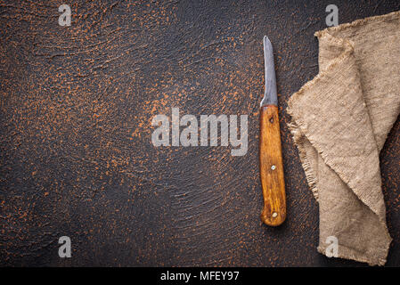 Old vintage knife on rusty background Stock Photo