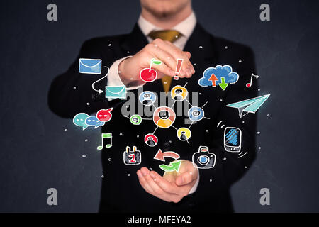 Colorful hand-drawn social media icons in the hands of a businessman  Stock Photo