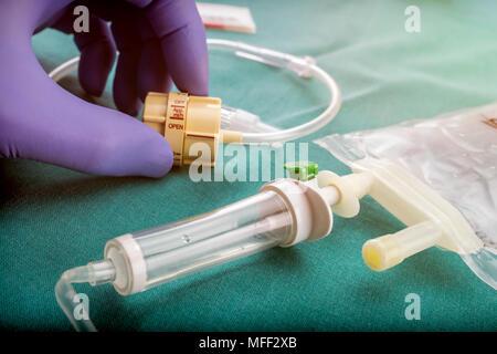 Doctor holds a flow dial on a hospital table, conceptual image Stock Photo